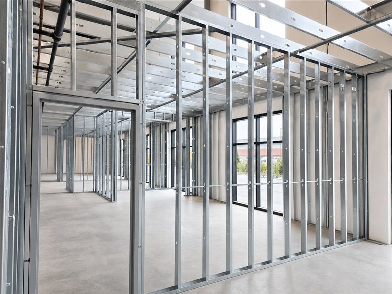 Cold-formed steel stud framing of interior walls and ceiling structure